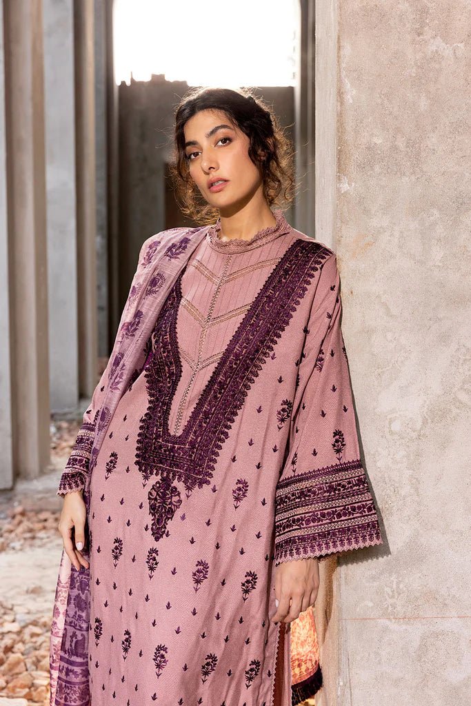 Model wearing Sobia Nazir Fall Edit '24 Design 7B, featuring a purple outfit with intricate embroidery, perfect for winter casual pret. Available online in the UK.