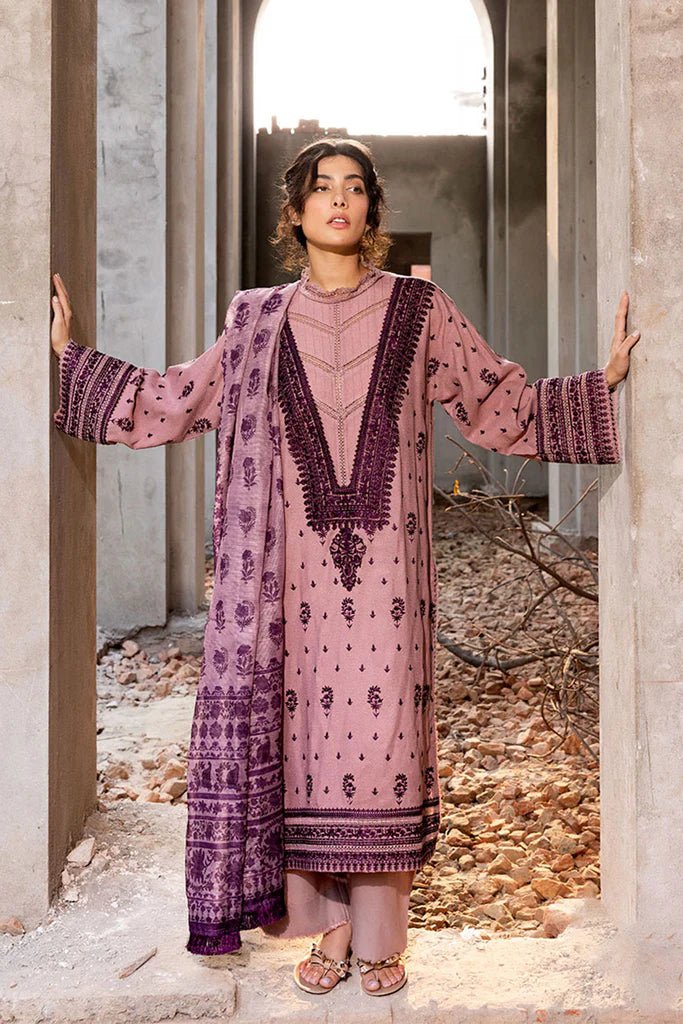 Model wearing Sobia Nazir Fall Edit '24 Design 7B, featuring a purple outfit with intricate embroidery, perfect for winter casual pret. Available online in the UK.