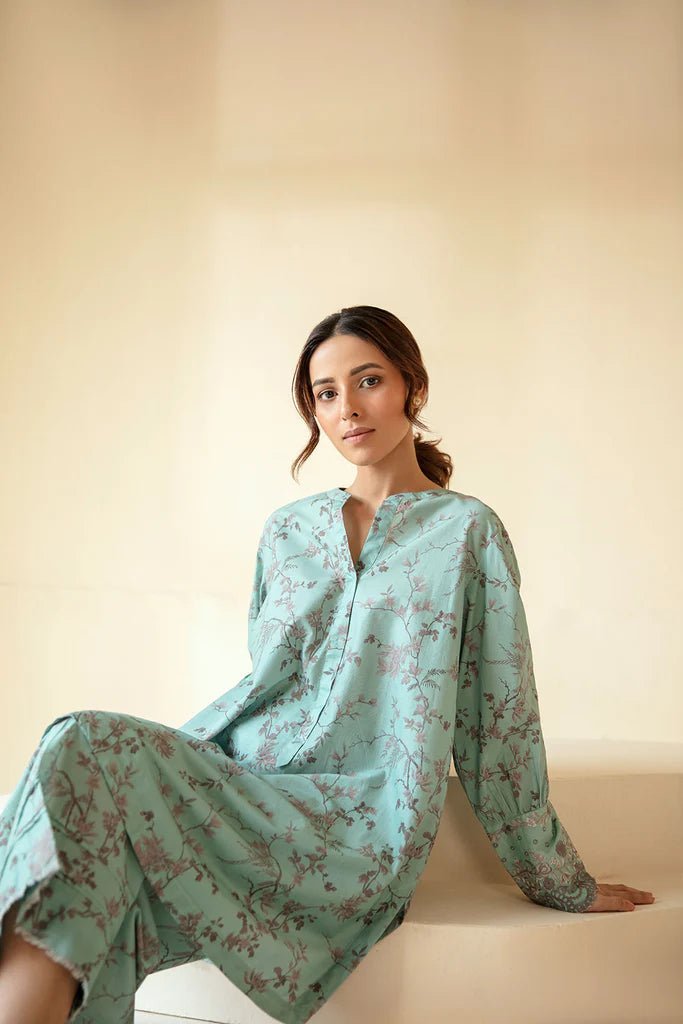 Model wearing Sobia Nazir Fall Edit '24 SNPP - 0322, showcasing a green outfit with detailed embroidery, ideal for winter casual pret. Available online in the UK.