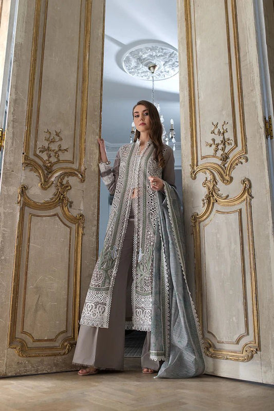 Model poses in a sophisticated Sobia Nazir DESIGN 11B, a UK Pakistani clothing choice.