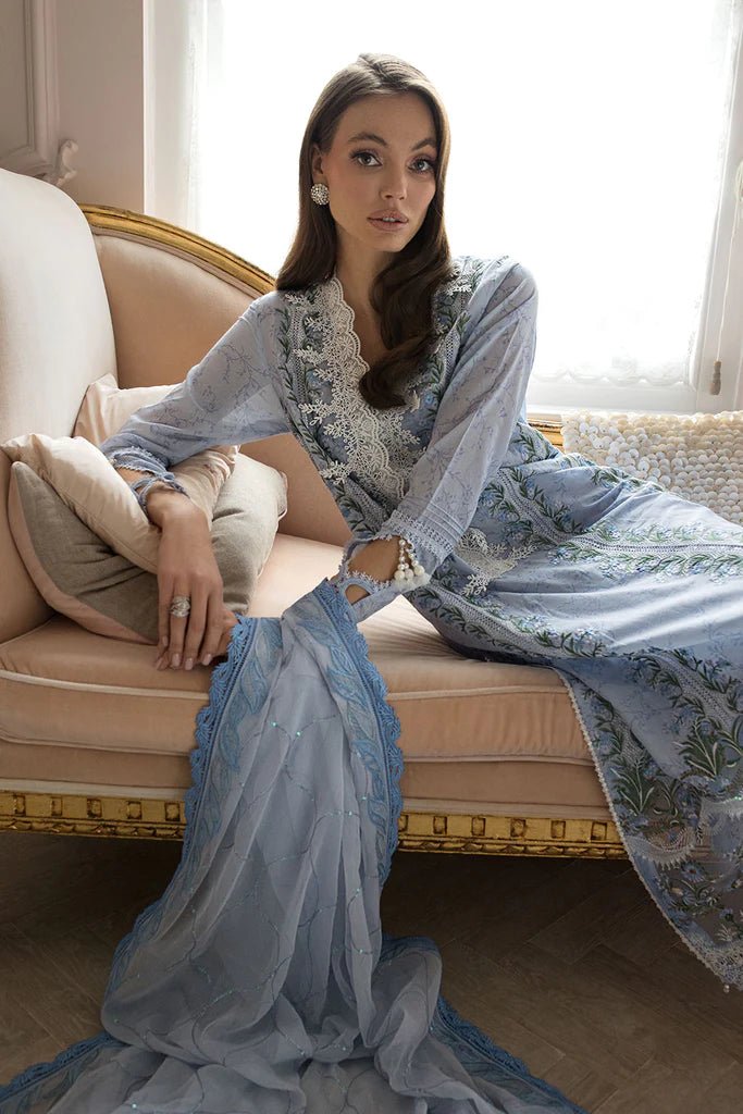 Model in Sobia Nazir DESIGN 13A, soft blue Pakistani lawn ensemble, UK's luxury choice.