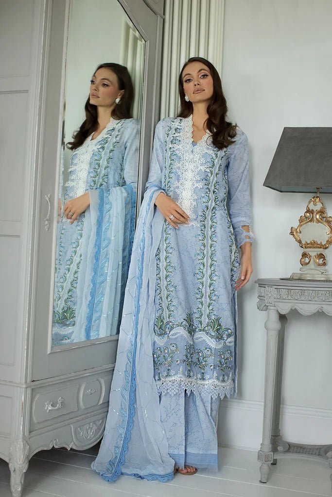 Model in Sobia Nazir DESIGN 13A, soft blue Pakistani lawn ensemble, UK's luxury choice.