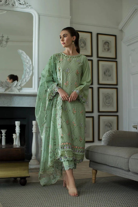 Model in Sobia Nazir DESIGN 2A, a serene green Pakistani lawn dress for the UK market.