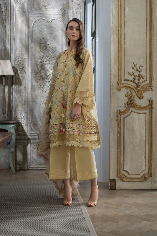 Model in elegant Sobia Nazir DESIGN 2B, a luxurious Pakistani lawn dress, UK collection.