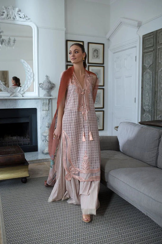 Model in Sobia Nazir DESIGN 5B, a pastel Pakistani lawn suit, UK's latest trend.