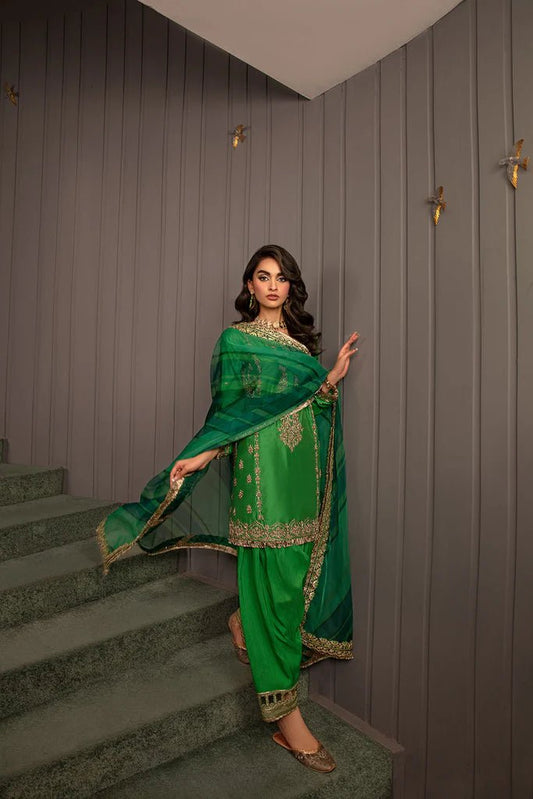 Model wearing Sobia Nazir Design 08 dress, vibrant green luxury pret, Pakistani designer wedding suit in UK.