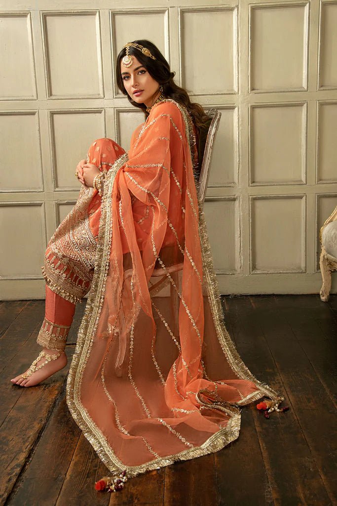 Model wearing Sobia Nazir's Design 01 from Nur Festive Collection '23, showcasing Pakistani clothes online in the UK.