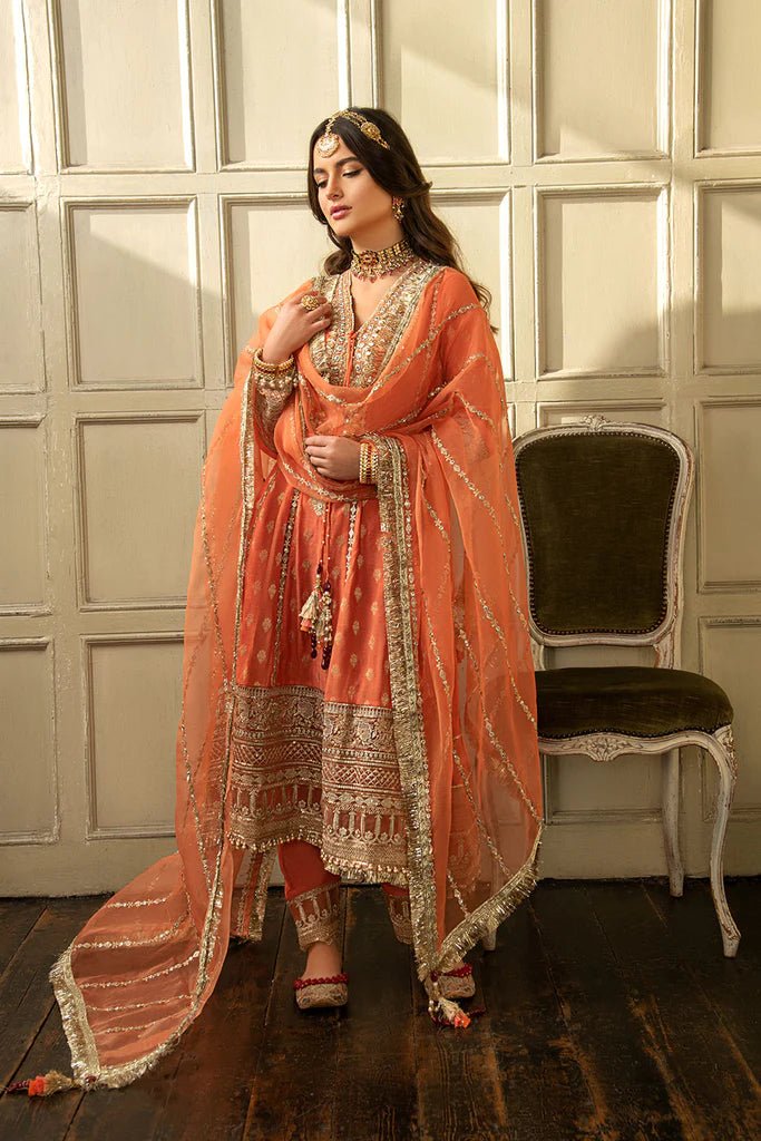 Model wearing Sobia Nazir's Design 01 from Nur Festive Collection '23, showcasing Pakistani clothes online in the UK.