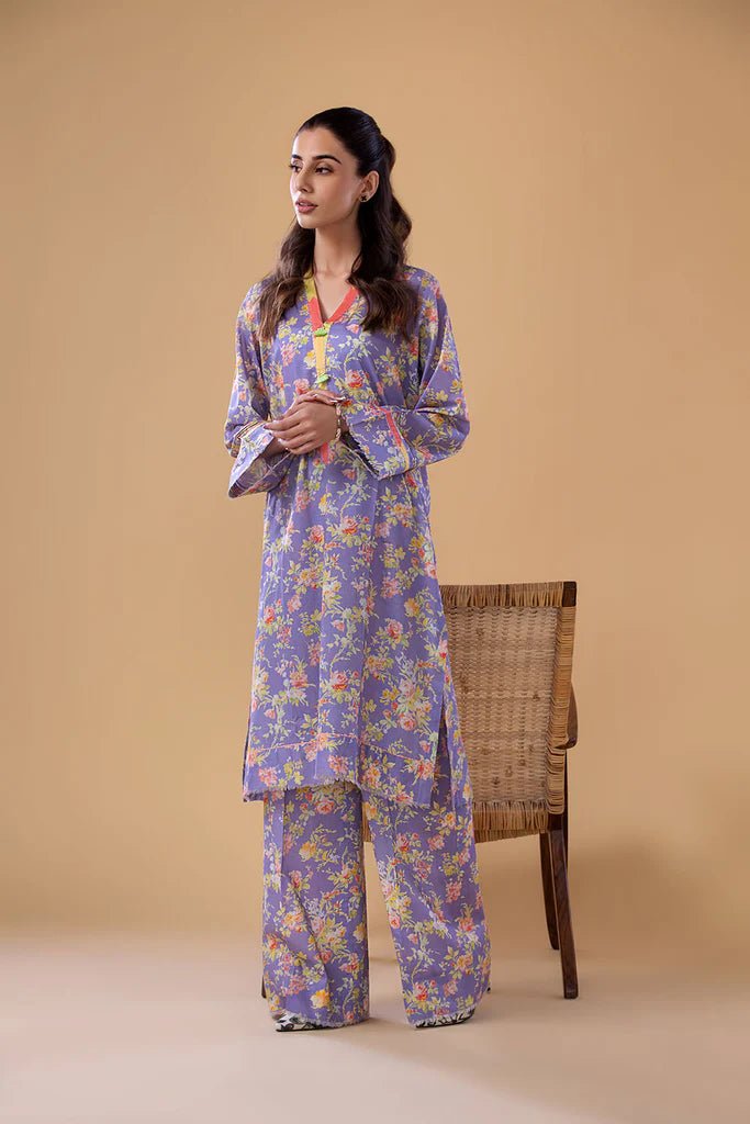 Model wearing a lavender SNPP - 24 - 0305 dress with floral print from Sobia Nazir's Pret '24 collection. Ideal for Pakistani clothes online in the UK.