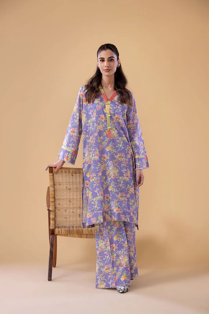 Model wearing a lavender SNPP - 24 - 0305 dress with floral print from Sobia Nazir's Pret '24 collection. Ideal for Pakistani clothes online in the UK.