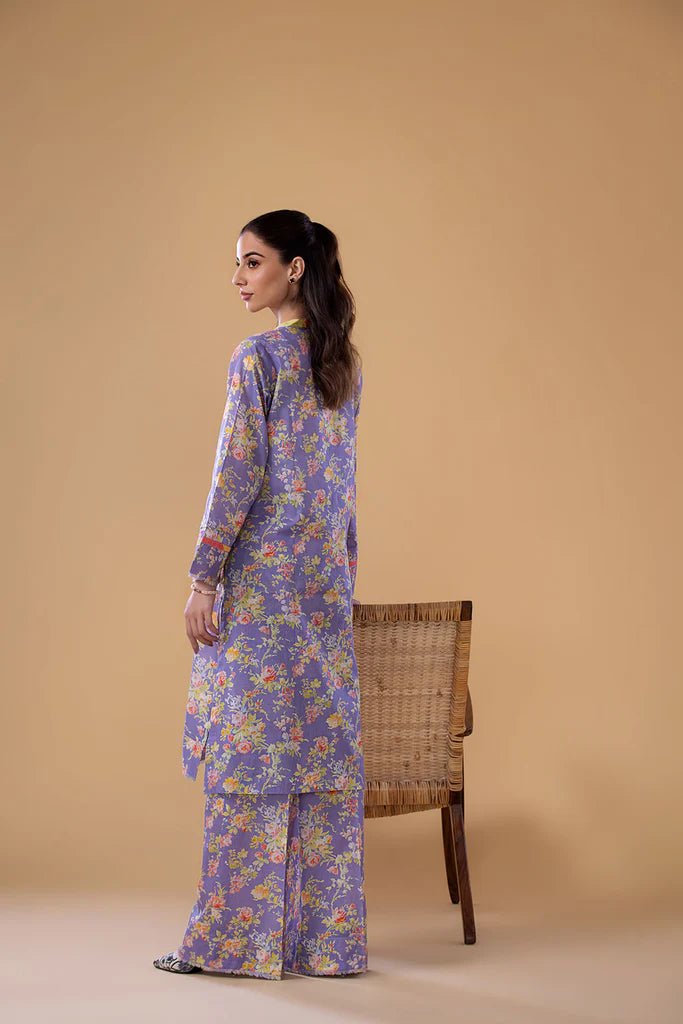 Model wearing a lavender SNPP - 24 - 0305 dress with floral print from Sobia Nazir's Pret '24 collection. Ideal for Pakistani clothes online in the UK.