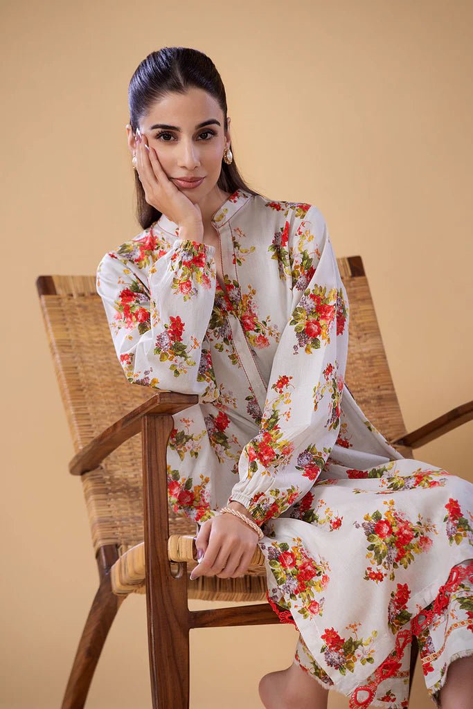 Model wearing a white dress with red and green floral print from Sobia Nazir's Pret '24 collection, SNPP - 24 - 0307. Perfect for showcasing Pakistani clothes online in the UK.