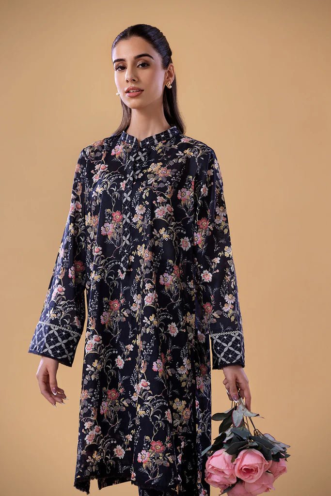 Model wearing a navy floral print dress with matching trousers from Sobia Nazir's Pret '24 collection, SNPP - 24 - 0308. Perfect for showcasing Pakistani clothes online in the UK, ideal for casual and semi - formal occasions.