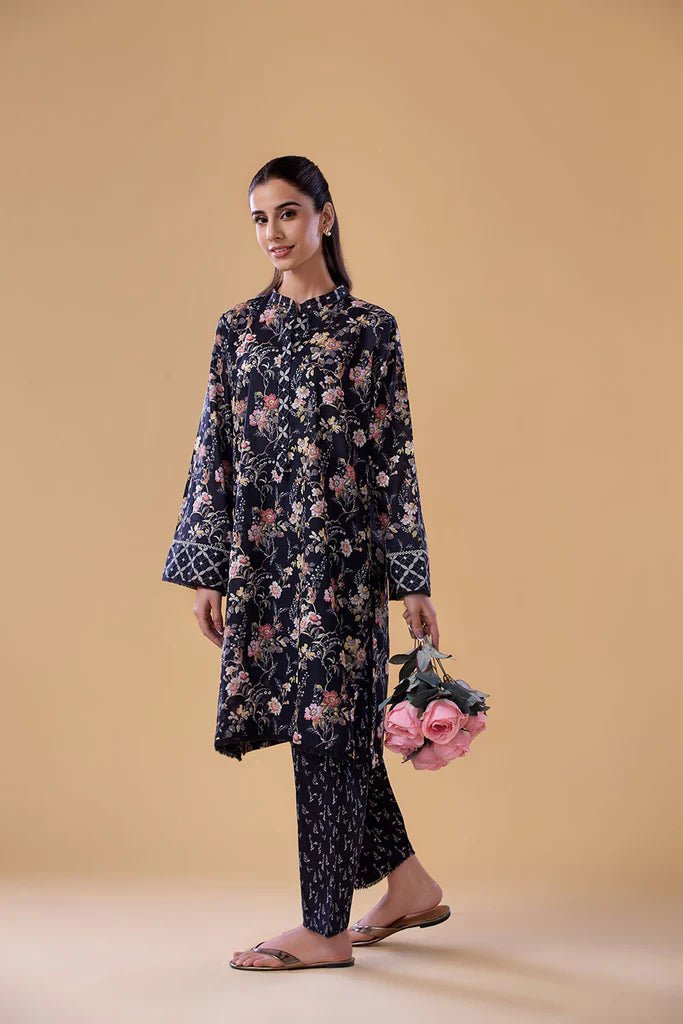 Model wearing a navy floral print dress with matching trousers from Sobia Nazir's Pret '24 collection, SNPP - 24 - 0308. Perfect for showcasing Pakistani clothes online in the UK, ideal for casual and semi - formal occasions.