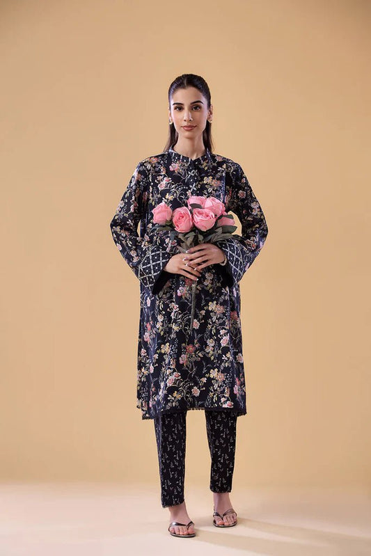 Model wearing a navy floral print dress with matching trousers from Sobia Nazir's Pret '24 collection, SNPP - 24 - 0308. Perfect for showcasing Pakistani clothes online in the UK, ideal for casual and semi - formal occasions.