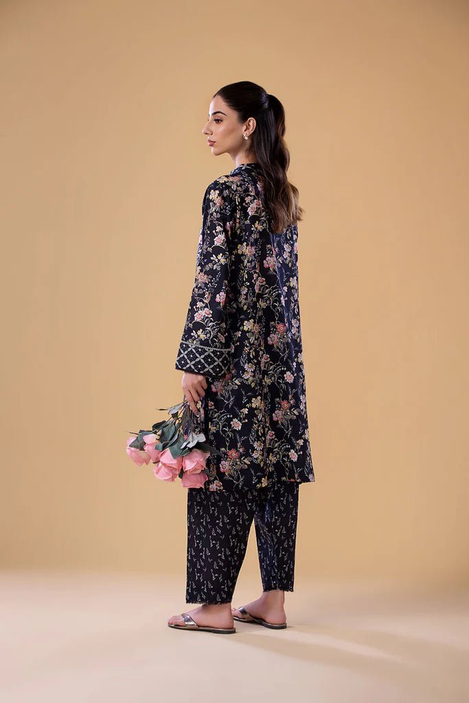 Model wearing a navy floral print dress with matching trousers from Sobia Nazir's Pret '24 collection, SNPP - 24 - 0308. Perfect for showcasing Pakistani clothes online in the UK, ideal for casual and semi - formal occasions.