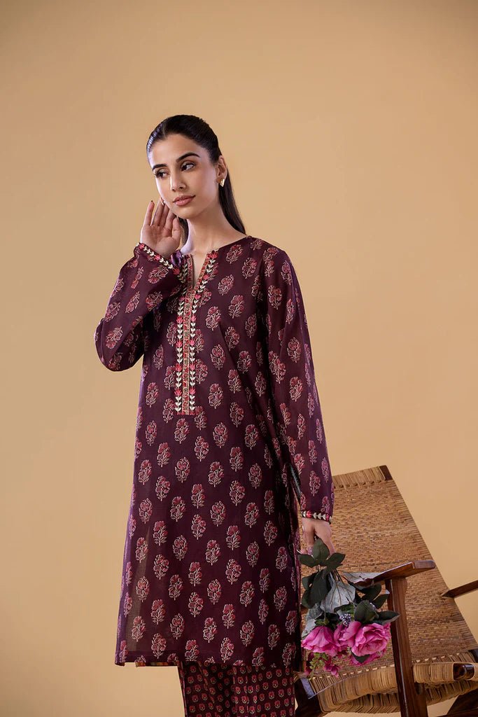 Model wearing a maroon SNPP - 24 - 0312 dress from Sobia Nazir's Pret '24 collection. Perfect for Pakistani clothes online in the UK.