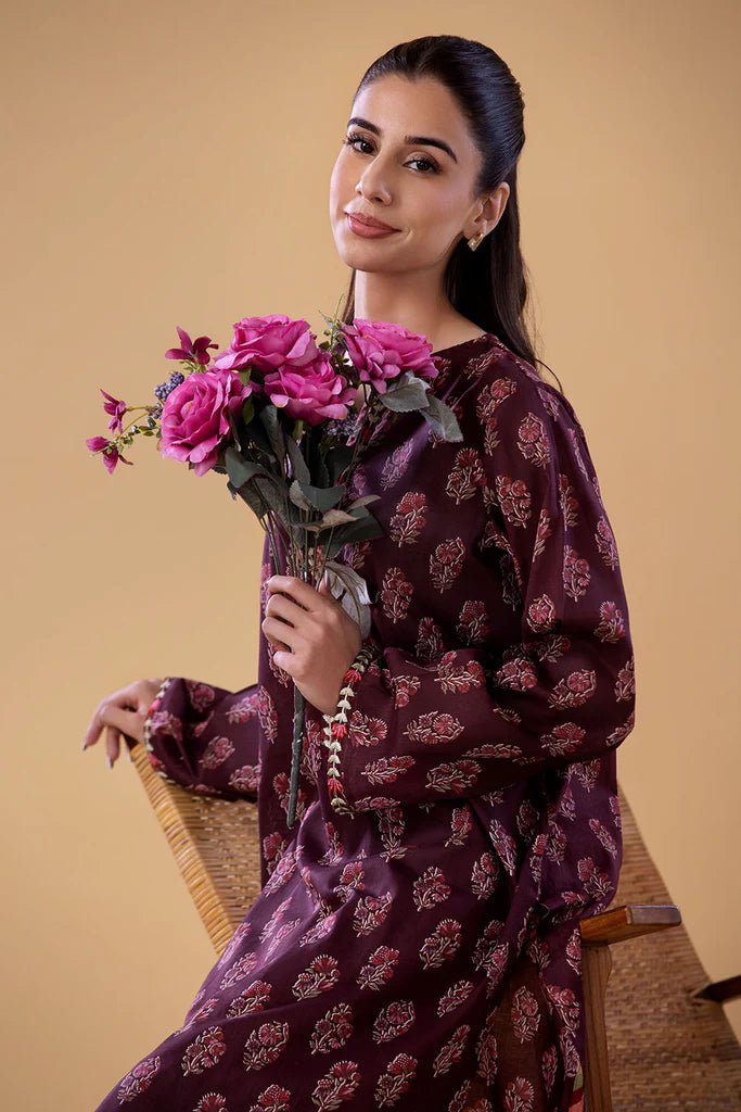 Model wearing a maroon SNPP - 24 - 0312 dress from Sobia Nazir's Pret '24 collection. Perfect for Pakistani clothes online in the UK.