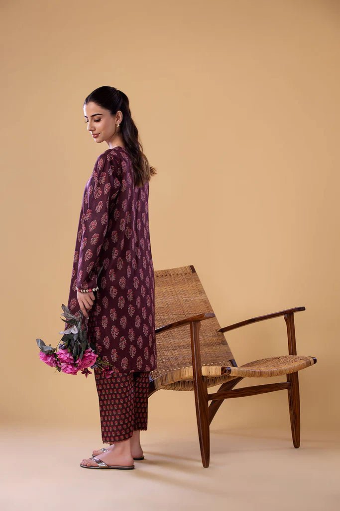 Model wearing a maroon SNPP - 24 - 0312 dress from Sobia Nazir's Pret '24 collection. Perfect for Pakistani clothes online in the UK.