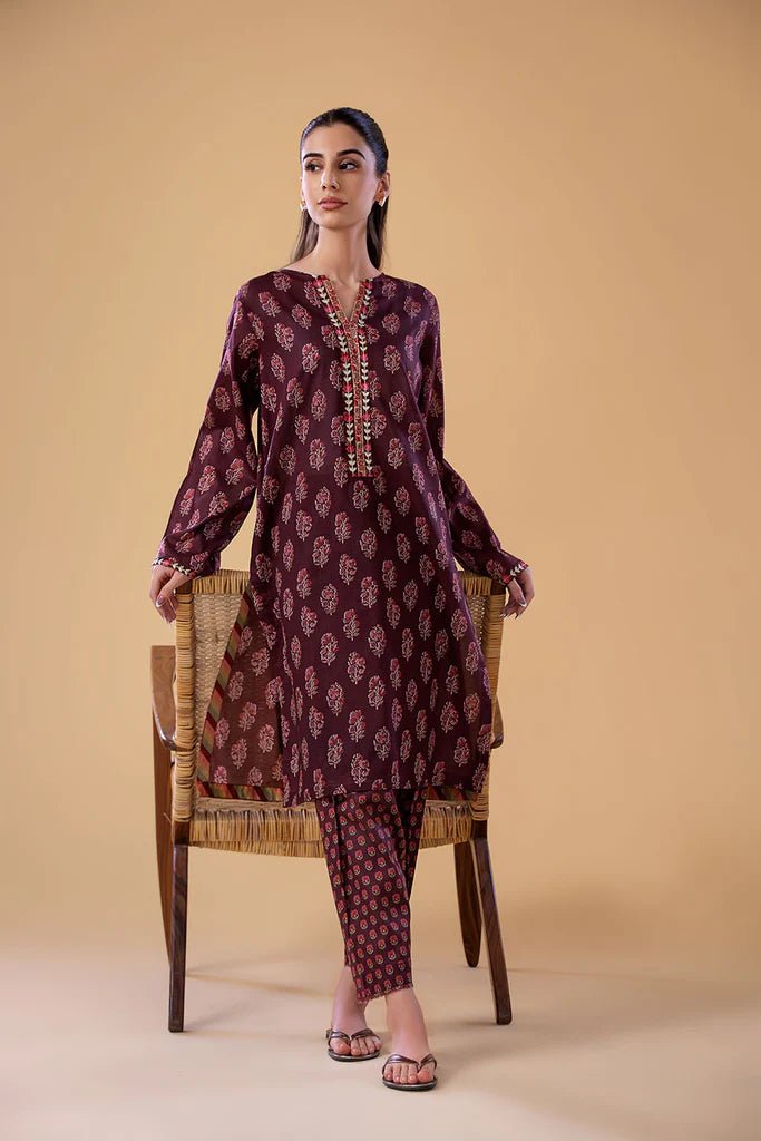 Model wearing a maroon SNPP - 24 - 0312 dress from Sobia Nazir's Pret '24 collection. Perfect for Pakistani clothes online in the UK.