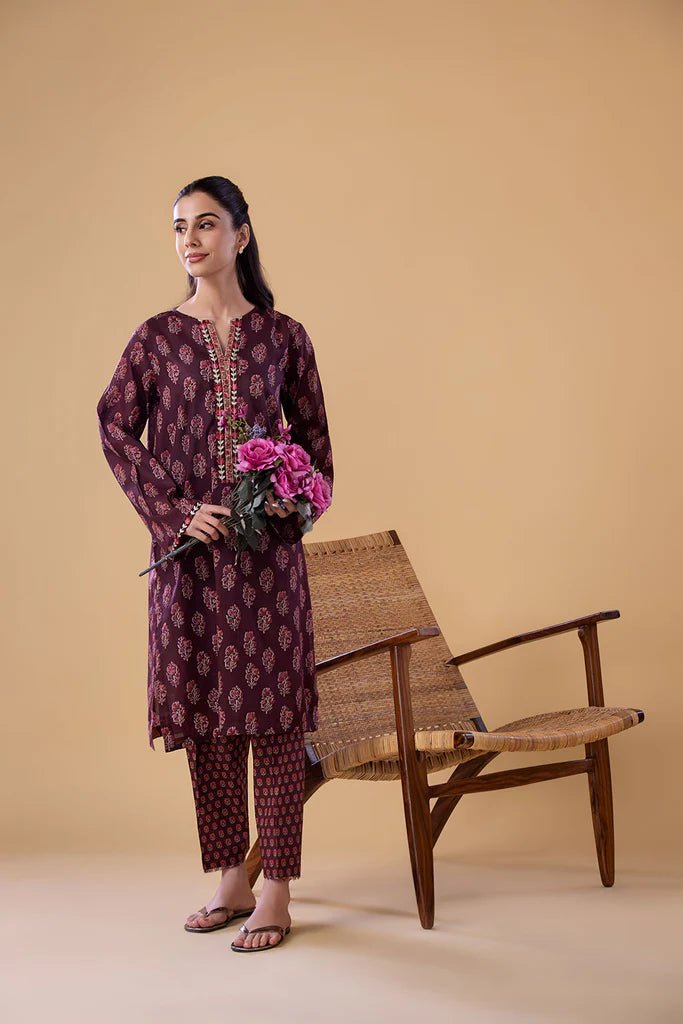 Model wearing a maroon SNPP - 24 - 0312 dress from Sobia Nazir's Pret '24 collection. Perfect for Pakistani clothes online in the UK.