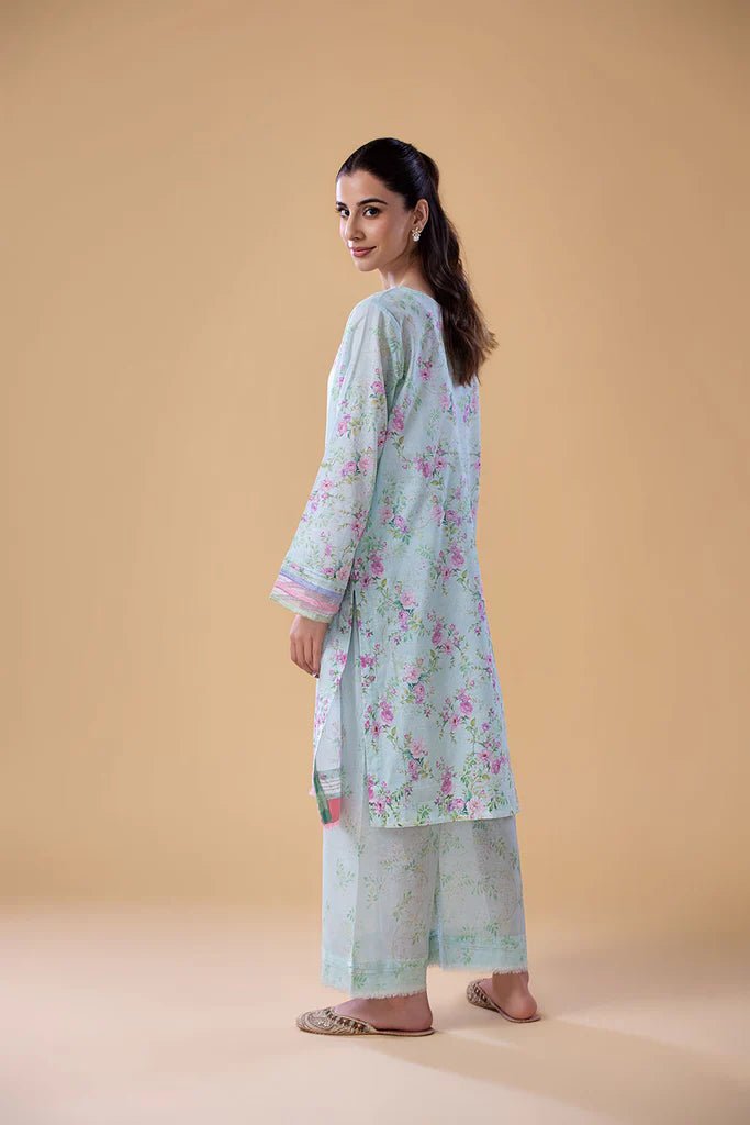 Model wearing SNPP - 24 - 0316 light blue floral dress from Sobia Nazir. Shop Sobia Nazir Pakistani clothes online in UK.