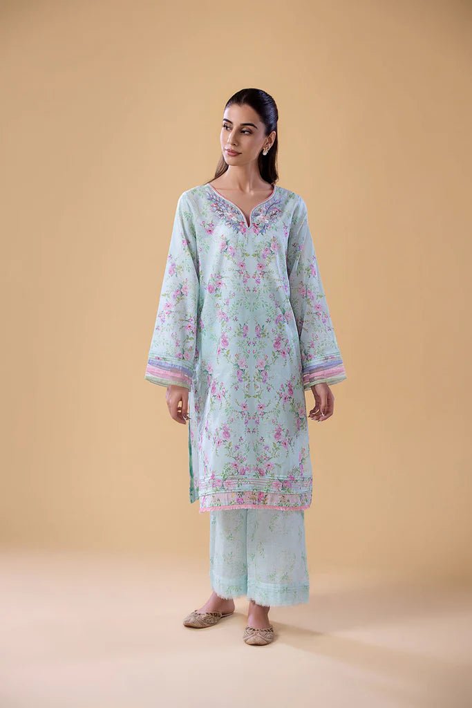 Model wearing SNPP - 24 - 0316 light blue floral dress from Sobia Nazir. Shop Sobia Nazir Pakistani clothes online in UK.