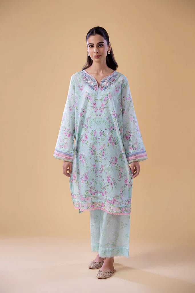 Model wearing SNPP - 24 - 0316 light blue floral dress from Sobia Nazir. Shop Sobia Nazir Pakistani clothes online in UK.