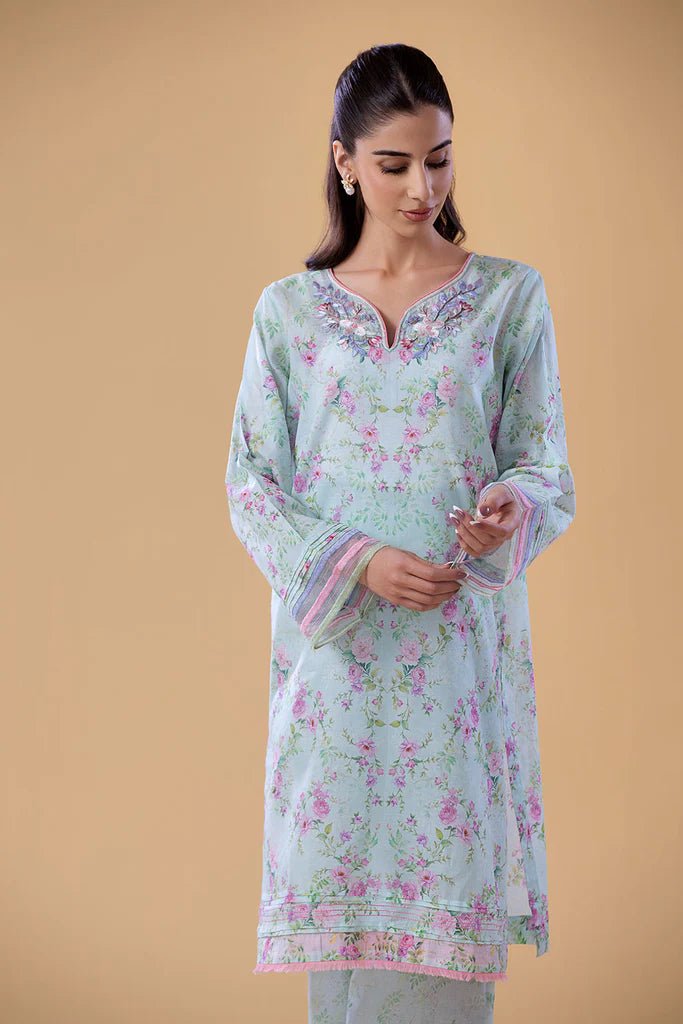 Model wearing SNPP - 24 - 0316 light blue floral dress from Sobia Nazir. Shop Sobia Nazir Pakistani clothes online in UK.