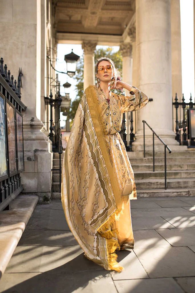 Model wearing Sobia Nazir Satin '24 Design 01, a golden and beige printed outfit with intricate patterns, perfect for winter. Available as Pakistani clothes online in the UK.