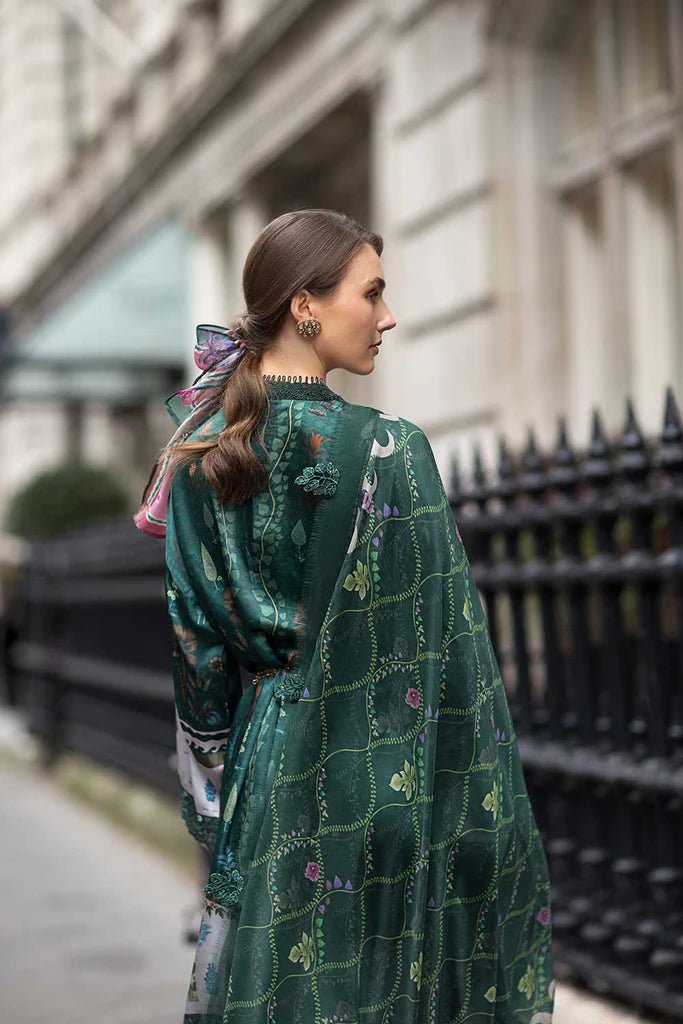 Model wearing Sobia Nazir Satin '24 Design 02, a deep green printed outfit with intricate detailing, ideal for winter. Available as Pakistani clothes online in the UK.