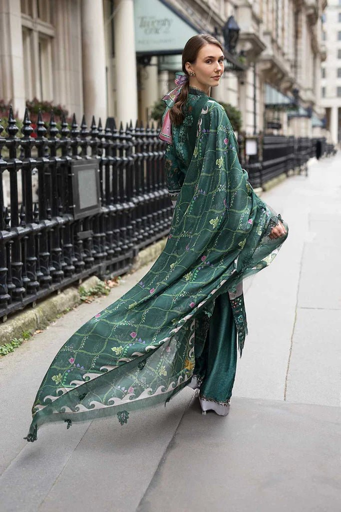 Model wearing Sobia Nazir Satin '24 Design 02, a deep green printed outfit with intricate detailing, ideal for winter. Available as Pakistani clothes online in the UK.