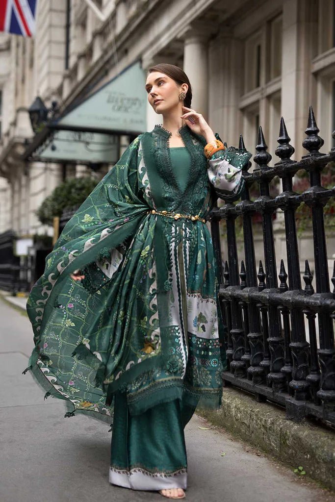 Model wearing Sobia Nazir Satin '24 Design 02, a deep green printed outfit with intricate detailing, ideal for winter. Available as Pakistani clothes online in the UK.