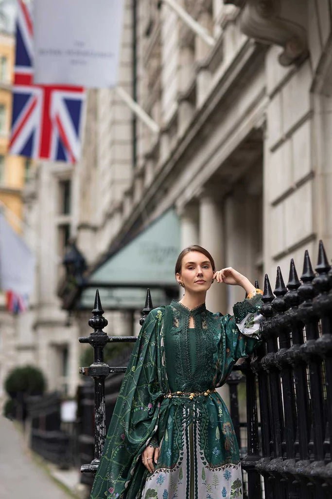 Model wearing Sobia Nazir Satin '24 Design 02, a deep green printed outfit with intricate detailing, ideal for winter. Available as Pakistani clothes online in the UK.