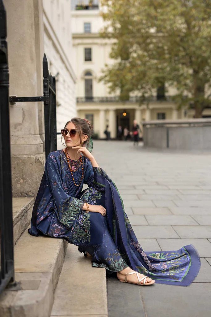 Model wearing Sobia Nazir Satin '24 Design 04, a navy blue floral printed outfit with elegant detailing, perfect for winter. Available as Pakistani clothes online in the UK.