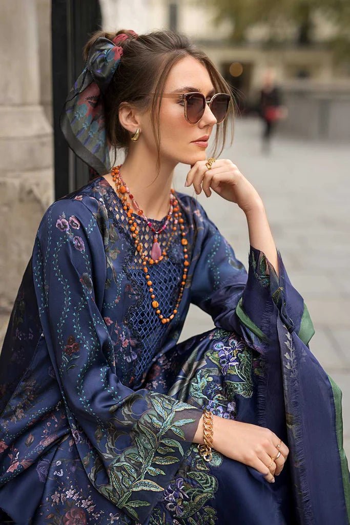 Model wearing Sobia Nazir Satin '24 Design 04, a navy blue floral printed outfit with elegant detailing, perfect for winter. Available as Pakistani clothes online in the UK.