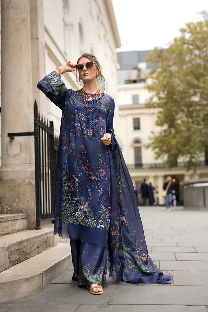 Model wearing Sobia Nazir Satin '24 Design 04, a navy blue floral printed outfit with elegant detailing, perfect for winter. Available as Pakistani clothes online in the UK.