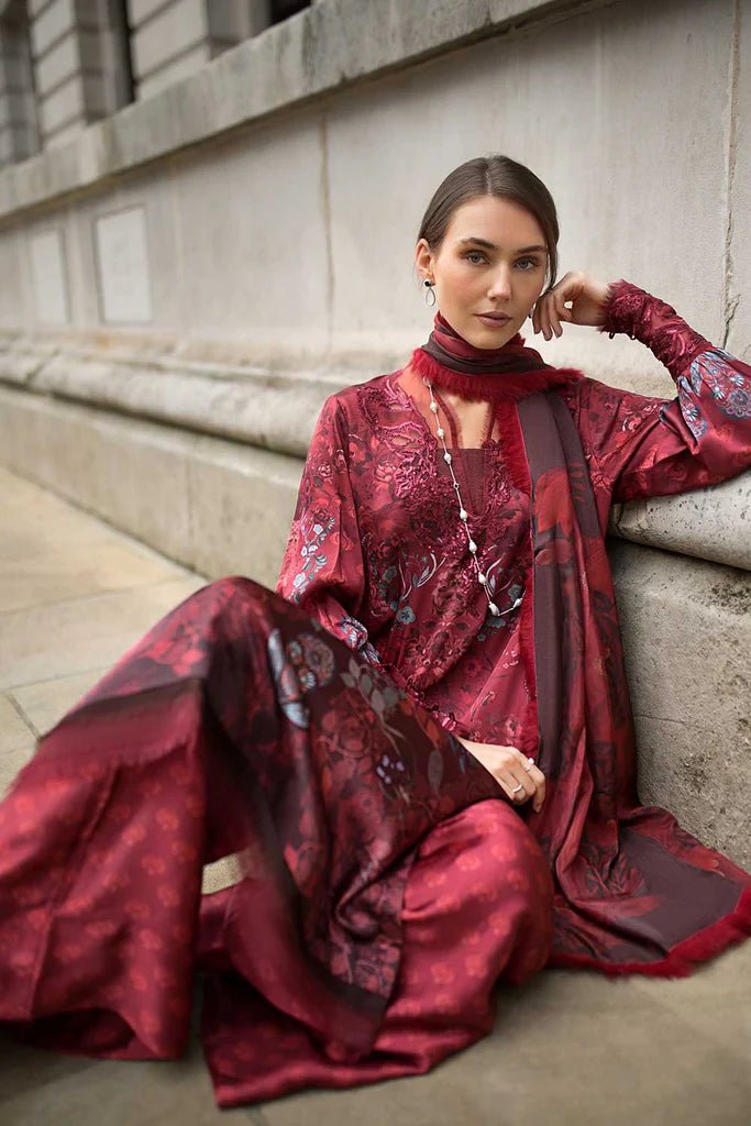 Model wearing Sobia Nazir Satin '24 Design 05, a rich maroon printed outfit with intricate detailing, perfect for winter. Available as Pakistani clothes online in the UK.