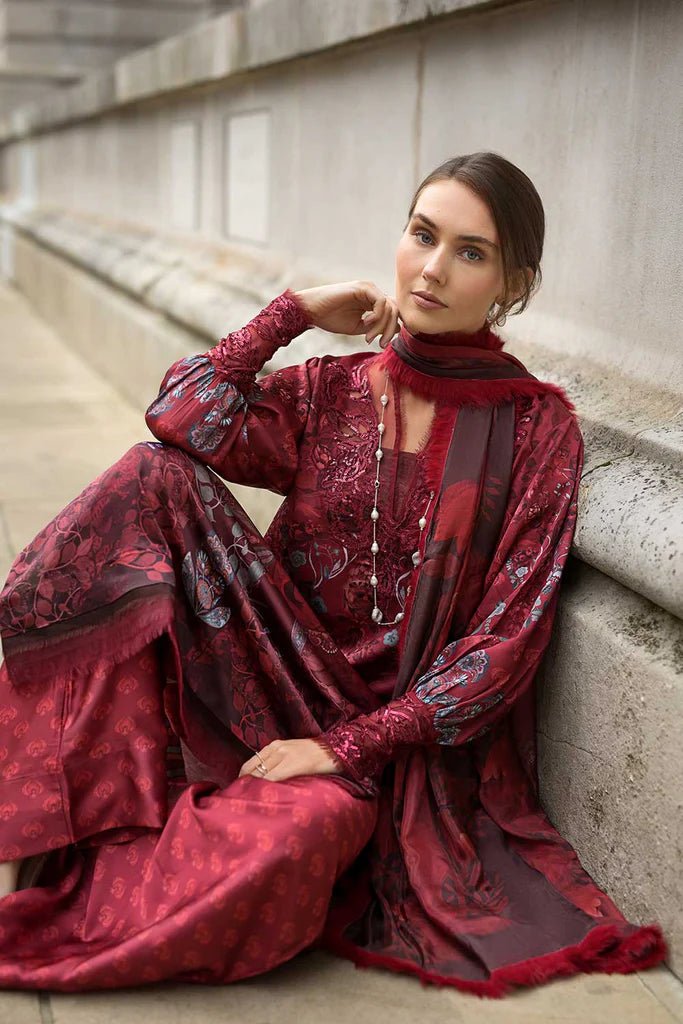 Model wearing Sobia Nazir Satin '24 Design 05, a rich maroon printed outfit with intricate detailing, perfect for winter. Available as Pakistani clothes online in the UK.