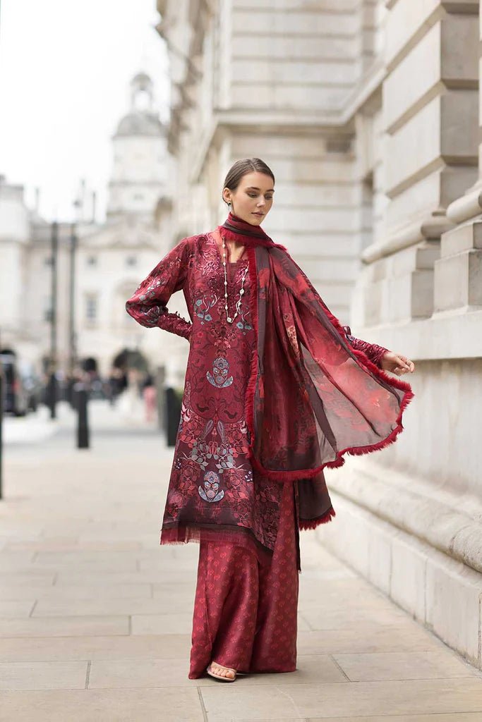 Model wearing Sobia Nazir Satin '24 Design 05, a rich maroon printed outfit with intricate detailing, perfect for winter. Available as Pakistani clothes online in the UK.