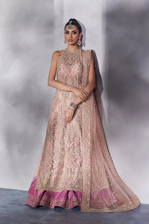 model wearing SORAYA ARIA Pakistani bridal dress in UK, blush pink with gold accents