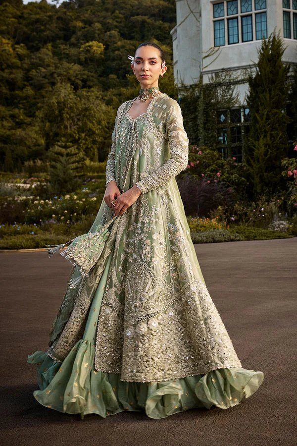 Model wearing mint green Astrid dress from Soraya, showcasing luxurious embroidery, ideal for Pakistani wedding clothes and Eid celebrations in the UK.