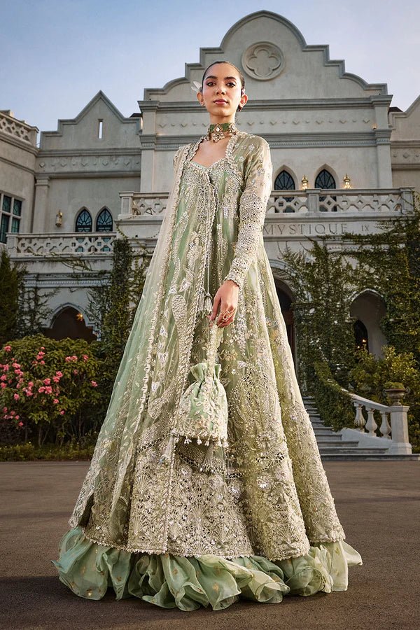 Model wearing mint green Astrid dress from Soraya, showcasing luxurious embroidery, ideal for Pakistani wedding clothes and Eid celebrations in the UK.