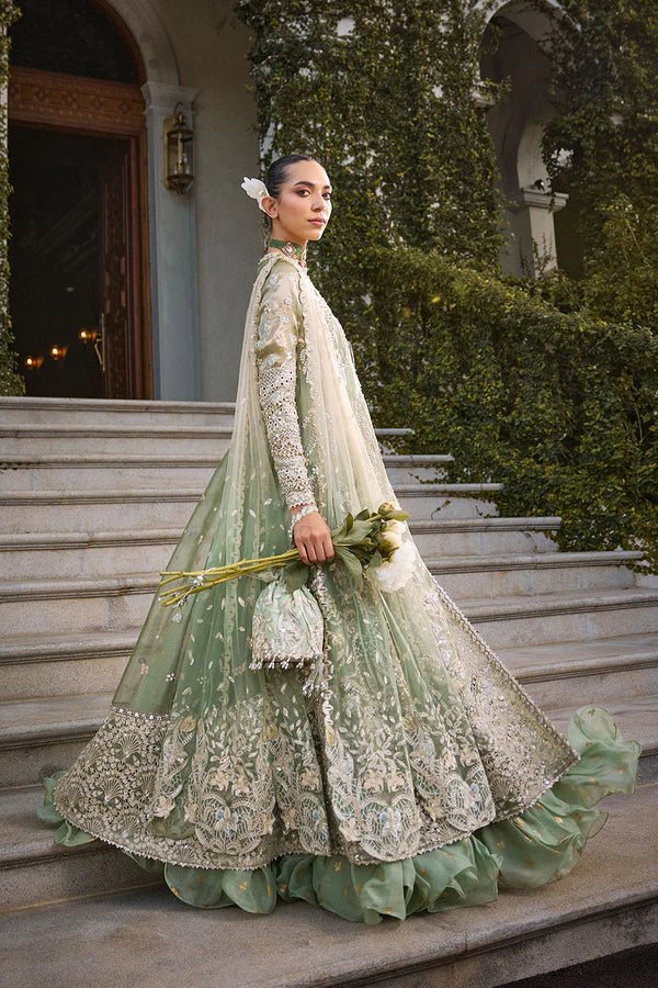 Model wearing mint green Astrid dress from Soraya, showcasing luxurious embroidery, ideal for Pakistani wedding clothes and Eid celebrations in the UK.