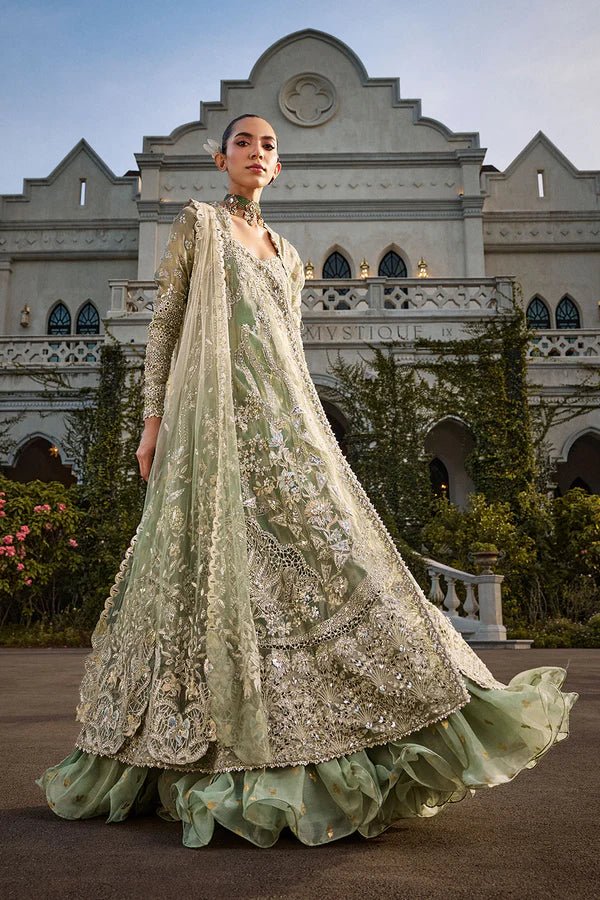 Model wearing mint green Astrid dress from Soraya, showcasing luxurious embroidery, ideal for Pakistani wedding clothes and Eid celebrations in the UK.