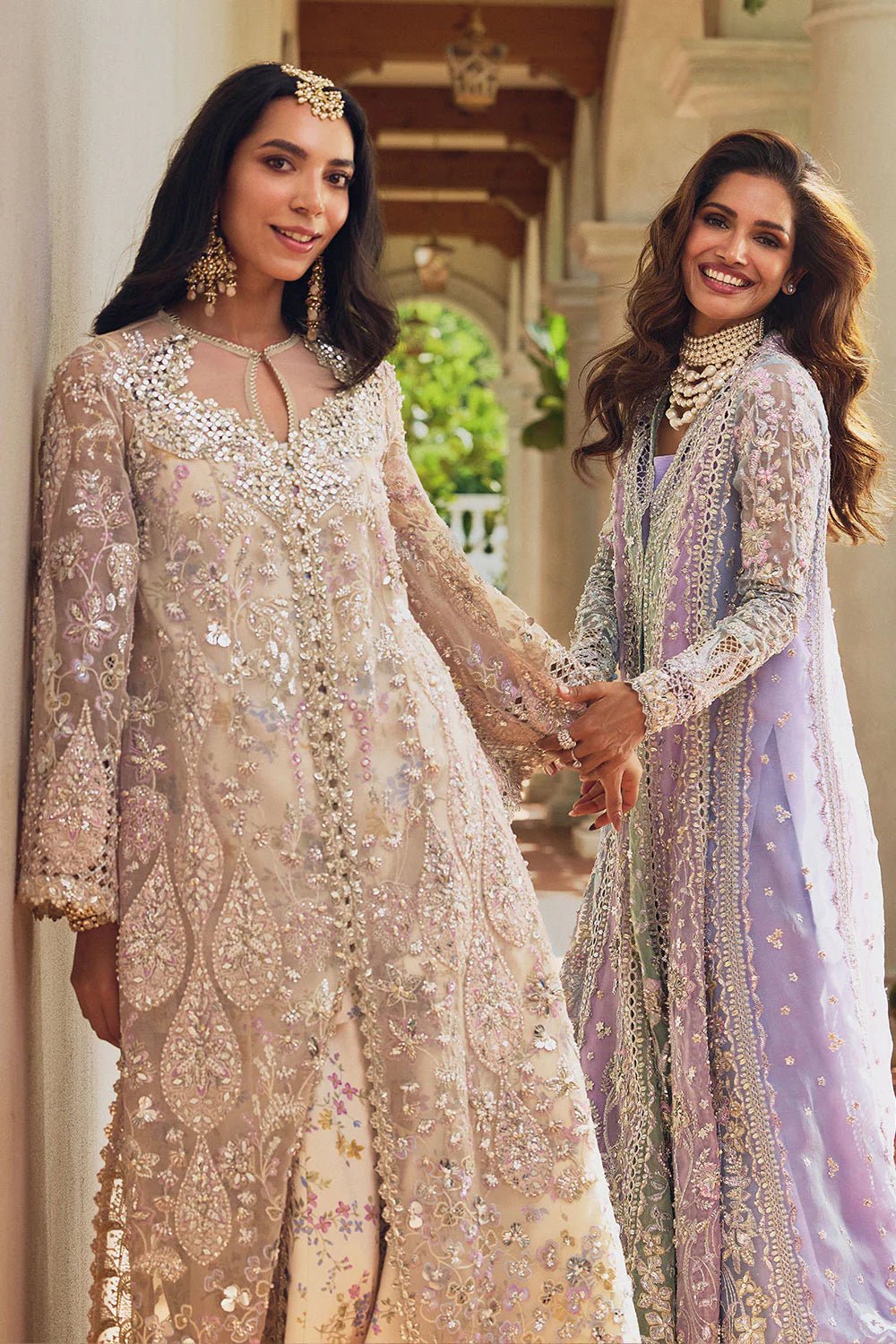 Model wearing Soraya Lumene Festive '25 Azilis dress in ivory with intricate floral embroidery and embellishments. Shop Pakistani bridal dresses online in the UK now.