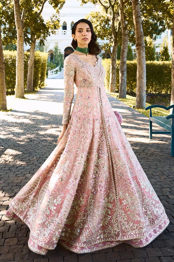 Model wearing pastel pink Florencea dress from Soraya, detailed with intricate golden embroidery, ideal for Pakistani wedding clothes in UK.