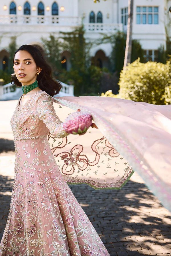 Model wearing pastel pink Florencea dress from Soraya, detailed with intricate golden embroidery, ideal for Pakistani wedding clothes in UK.