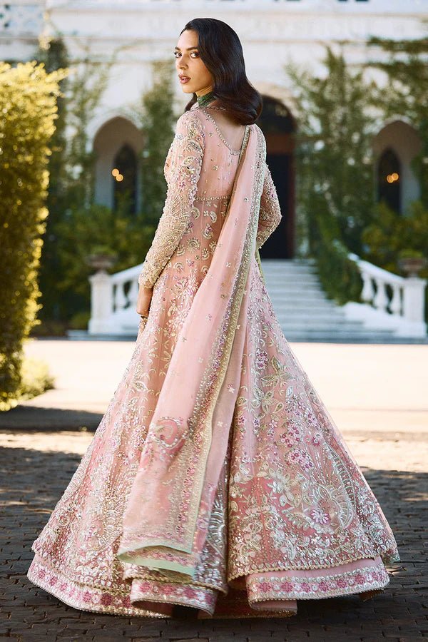 Model wearing pastel pink Florencea dress from Soraya, detailed with intricate golden embroidery, ideal for Pakistani wedding clothes in UK.