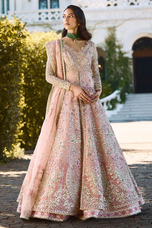 Model wearing pastel pink Florencea dress from Soraya, detailed with intricate golden embroidery, ideal for Pakistani wedding clothes in UK.